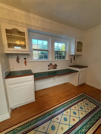a view of kitchen and an empty room