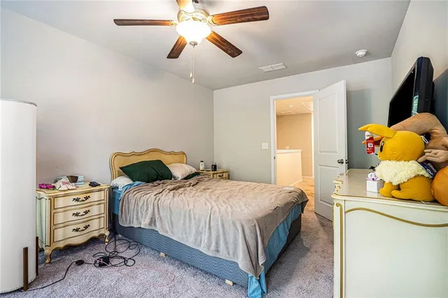 a bedroom with a bed and dresser