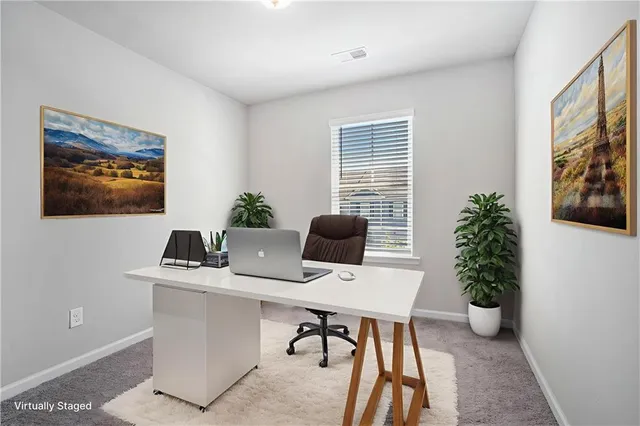 a workspace with furniture and window