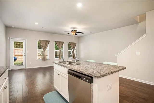 a view of kitchen island with granite countertop living room