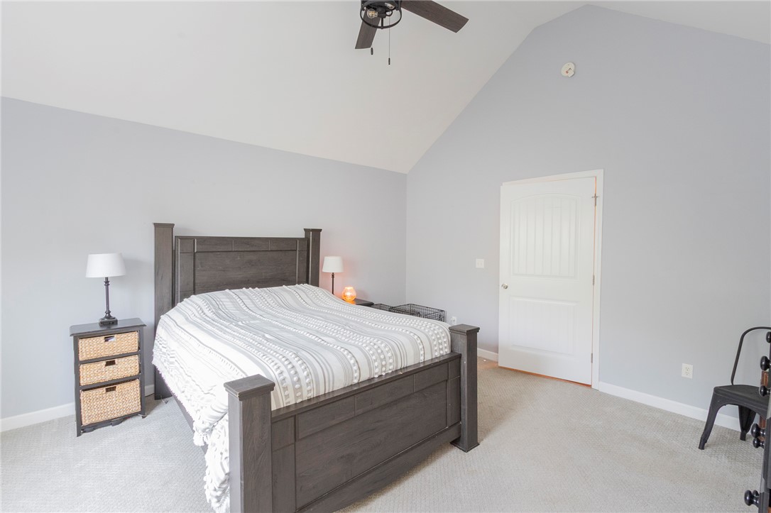 861 North Old Pendleton Road Liberty, SC 29657 - Photo 18 of 45 Lofty vaulted ceilings elevate this well-appointed bedroom, offering ample vertical space and natural light.