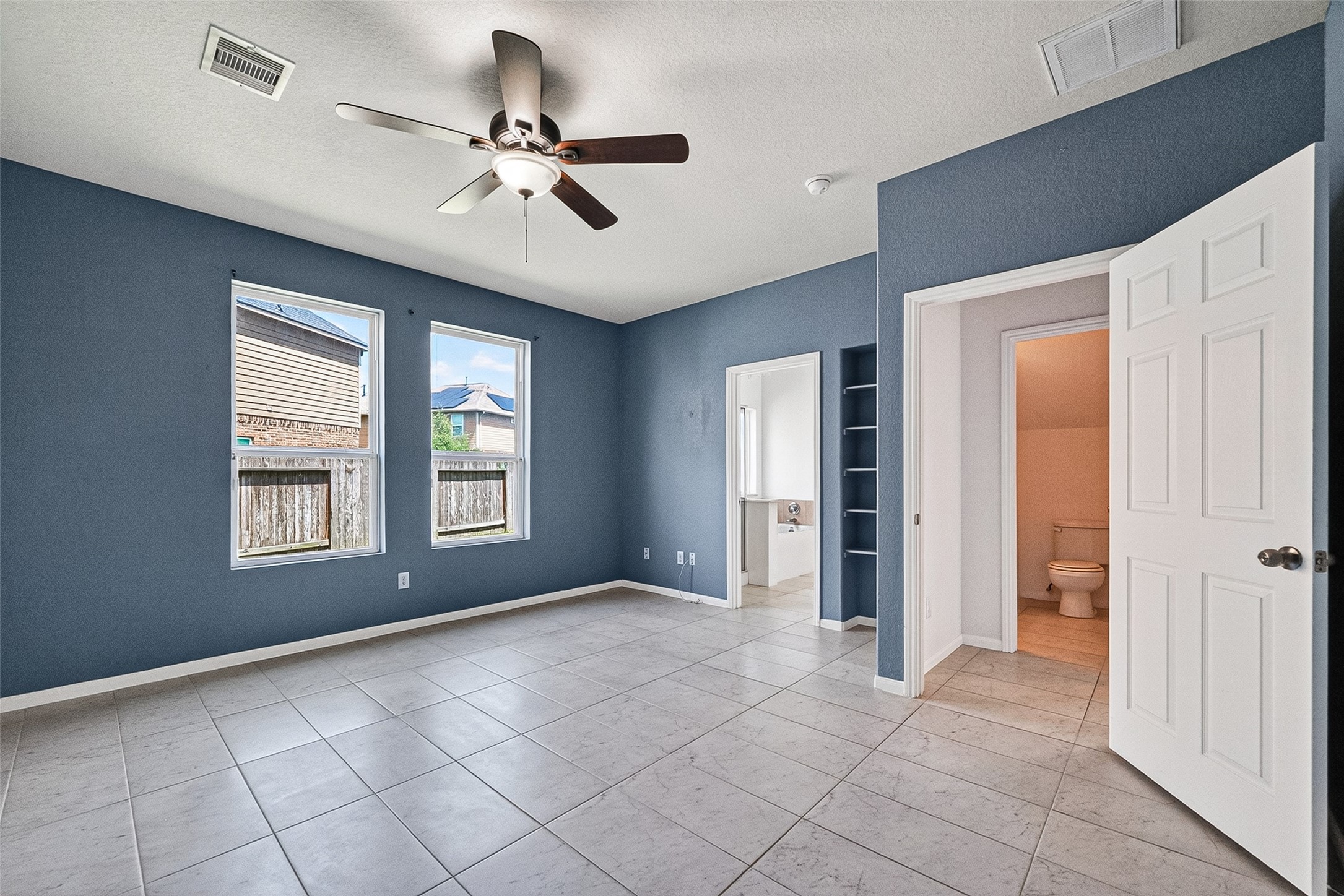 2702 Modano Court Fresno, TX 77545 - Photo 14 of 46 a view of an empty room with a window