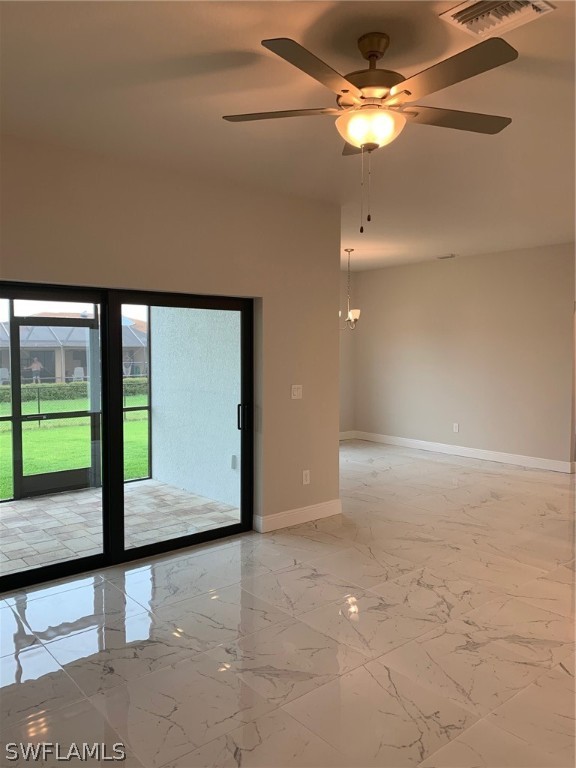 130 Southwest 37th Avenue Cape Coral, FL 33991 - Photo 11 of 30 a view of a livingroom with a ceiling fan