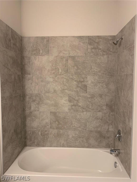 130 Southwest 37th Avenue Cape Coral, FL 33991 - Photo 18 of 30 a bathroom with a bathtub