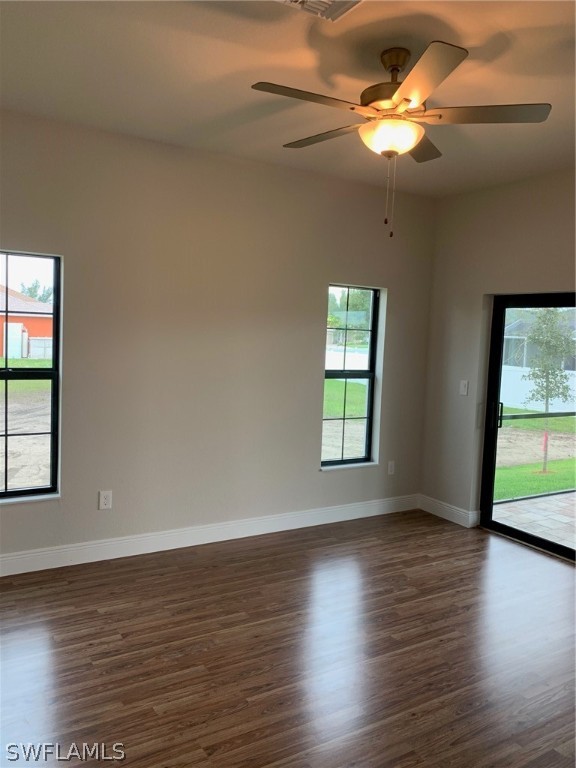 130 Southwest 37th Avenue Cape Coral, FL 33991 - Photo 19 of 30 wooden floor in an empty room with a window