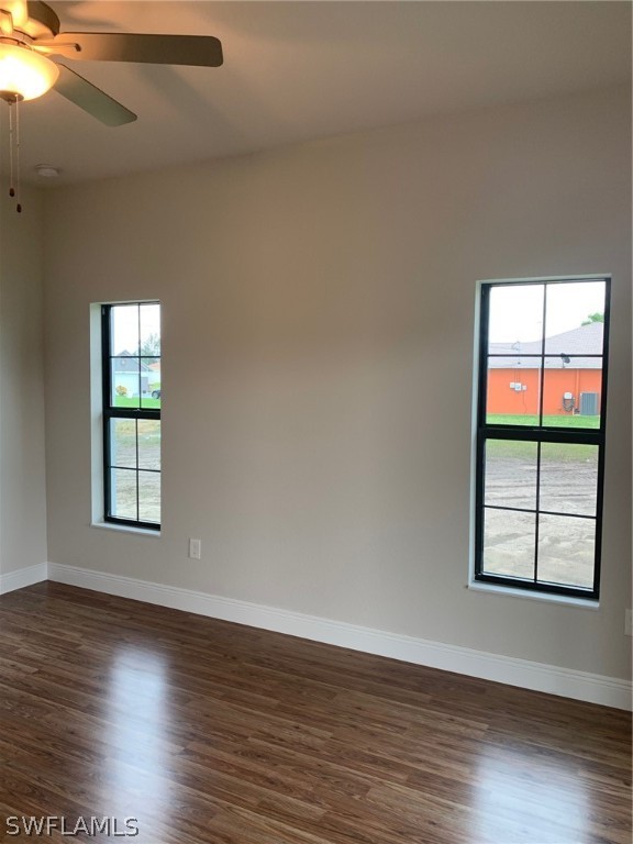 130 Southwest 37th Avenue Cape Coral, FL 33991 - Photo 20 of 30 an empty room with wooden floor and windows