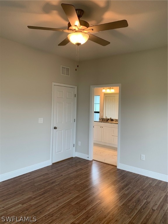 130 Southwest 37th Avenue Cape Coral, FL 33991 - Photo 21 of 30 a view of an empty room and wooden floor