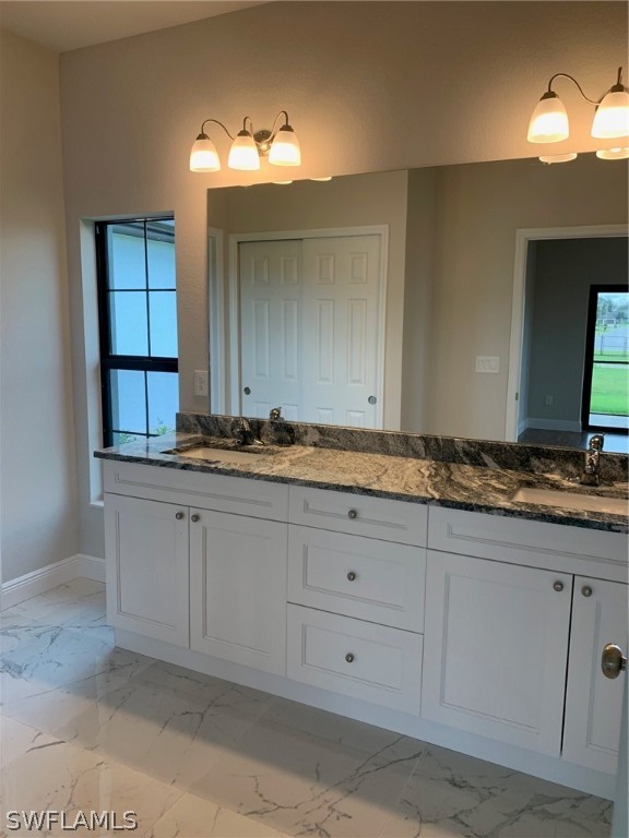 130 Southwest 37th Avenue Cape Coral, FL 33991 - Photo 22 of 30 a bathroom with a sink and a mirror