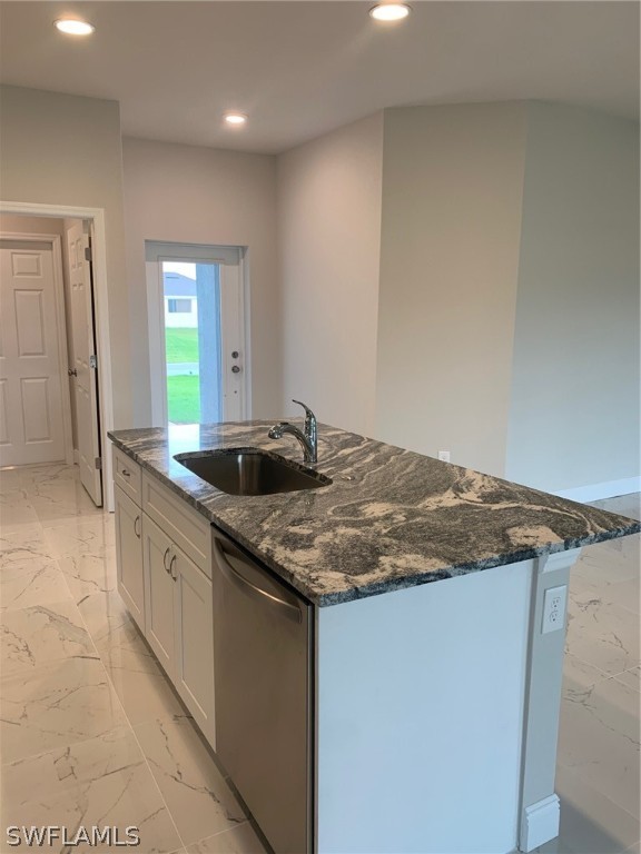 130 Southwest 37th Avenue Cape Coral, FL 33991 - Photo 5 of 30 a kitchen with stainless steel appliances granite countertop a sink and a granite counter tops