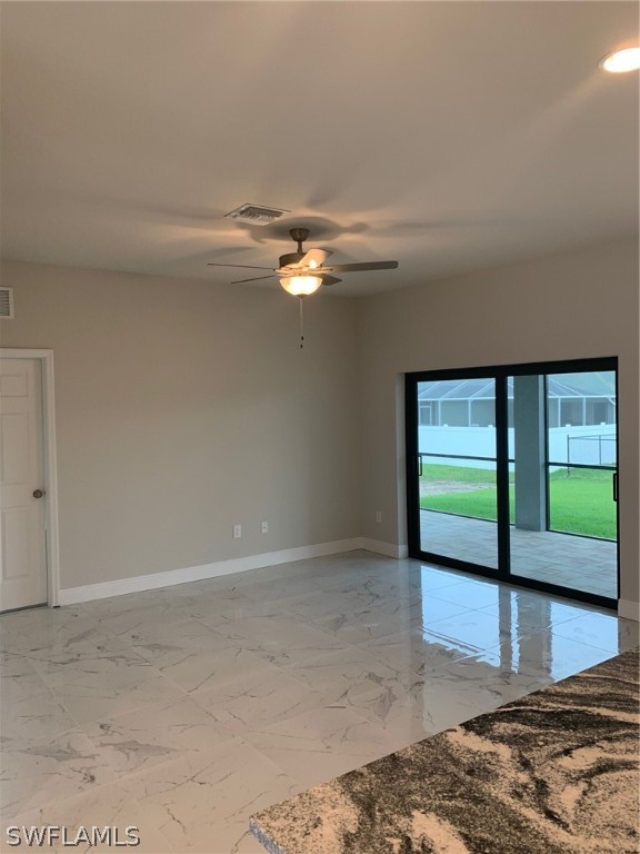 130 Southwest 37th Avenue Cape Coral, FL 33991 - Photo 9 of 30 a view of a big room with wooden floor and a floor to ceiling window