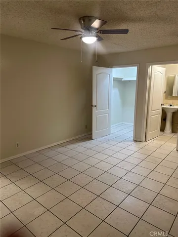 a view of a livingroom and a chandelier fan