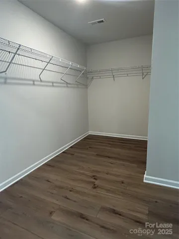 a view of a room with racks on the wall