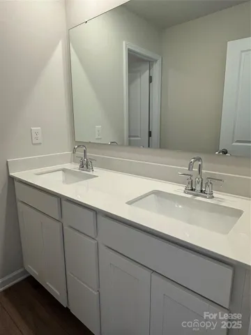 a bathroom with a shower a toilet and a sink