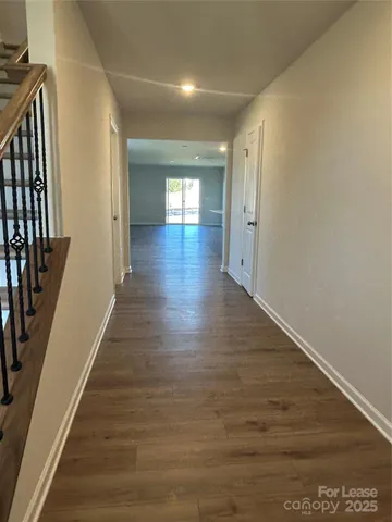 a view of gallery with wooden floor