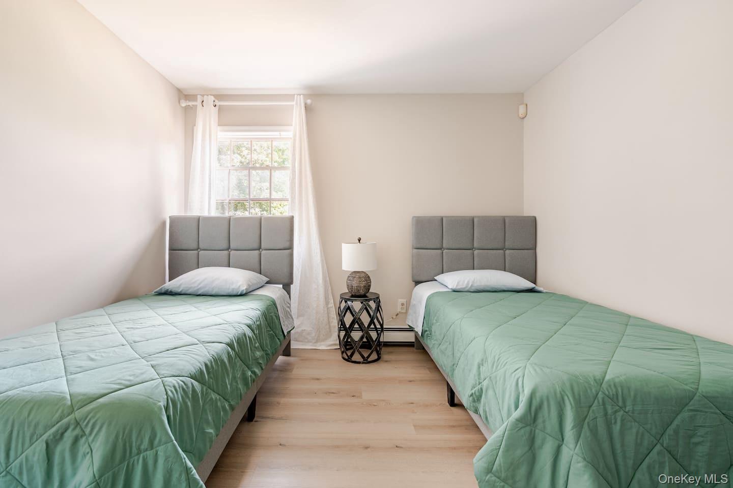 1241 Ridgebury Road New Hampton, NY 10958 - Photo 12 of 21 a bedroom with a bed and window