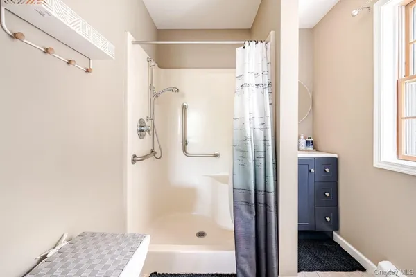 a bathroom with a shower and a tub