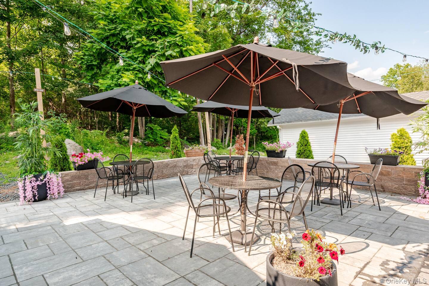 1241 Ridgebury Road New Hampton, NY 10958 - Photo 17 of 21 a view of patio with chairs and table under an umbrella