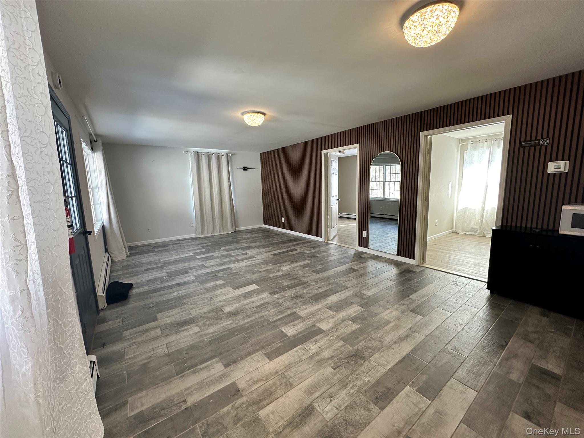 1241 Ridgebury Road New Hampton, NY 10958 - Photo 2 of 21 a view of livingroom with hardwood floor and a ceiling fan