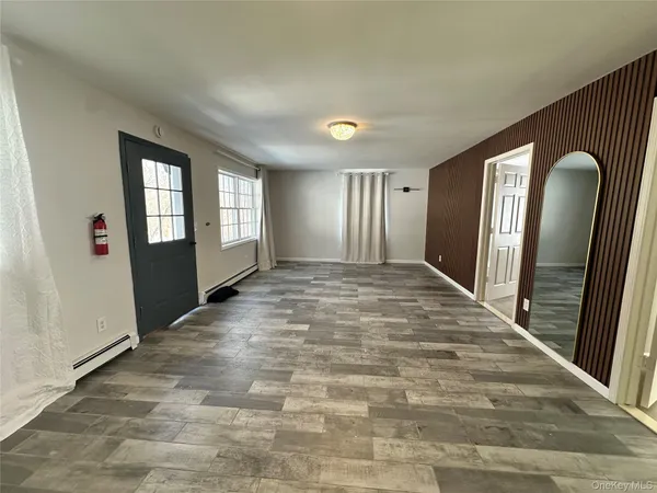 a view of entryway with window and stairs