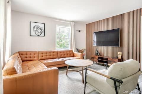 1241 Ridgebury Road New Hampton, NY 10958 - Photo 5 of 21 a living room with furniture and a flat screen tv