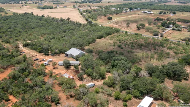 an aerial view of residential houses with outdoor space