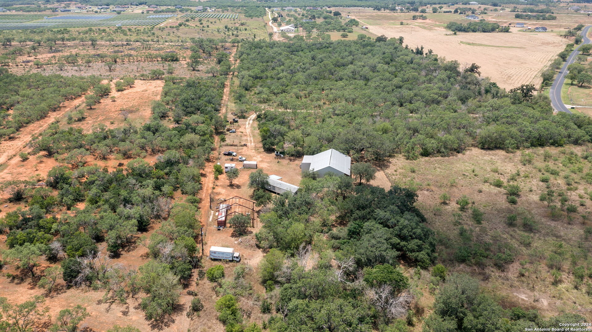 19366 Benton City Road Von Ormy, TX 78073 - Photo 14 of 24 a view of a yard with a mountain