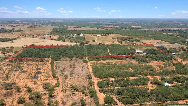 an aerial view of residential building and lake