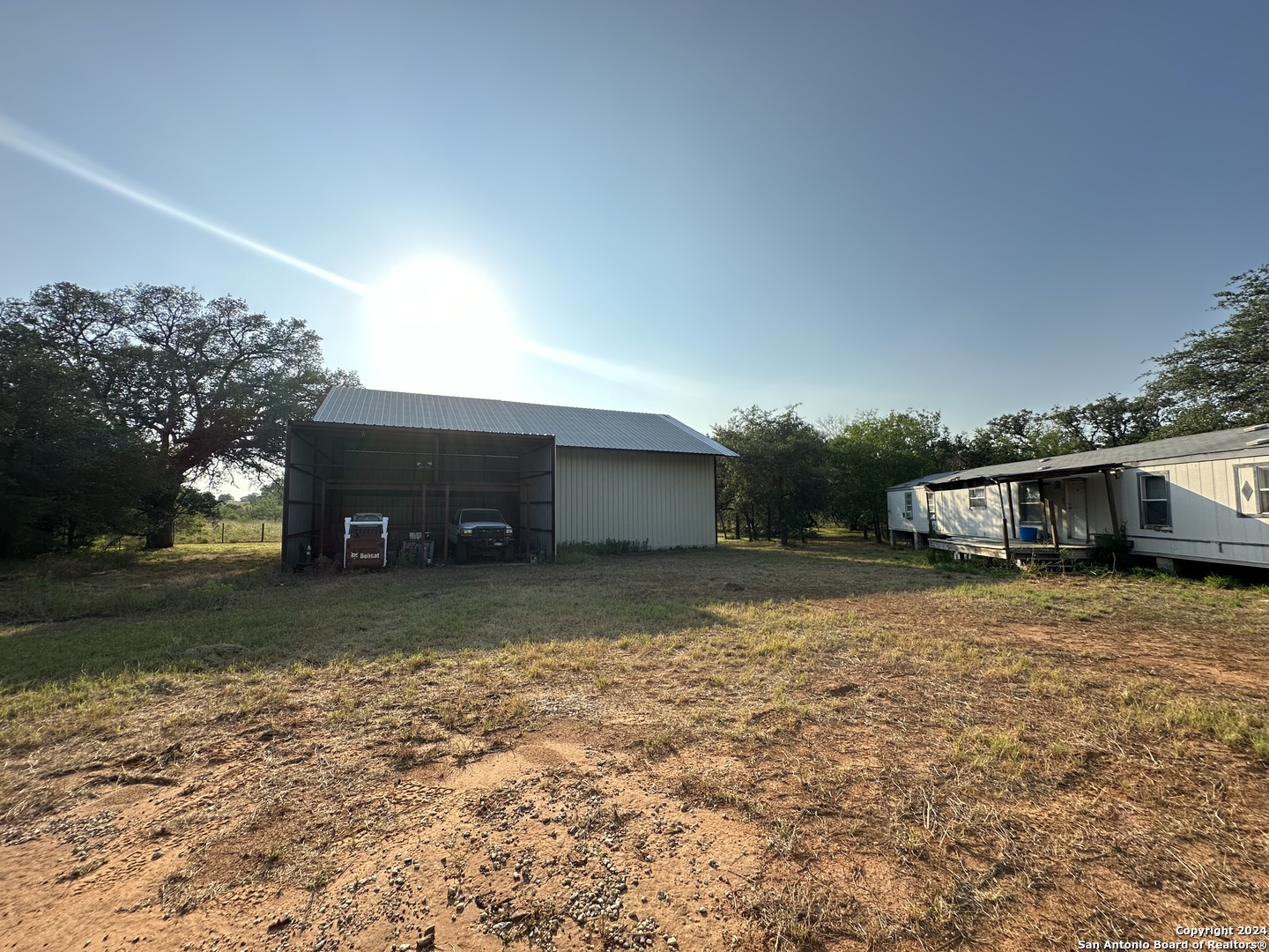 19366 Benton City Road Von Ormy, TX 78073 - Photo 24 of 24 a house view with a backyard space