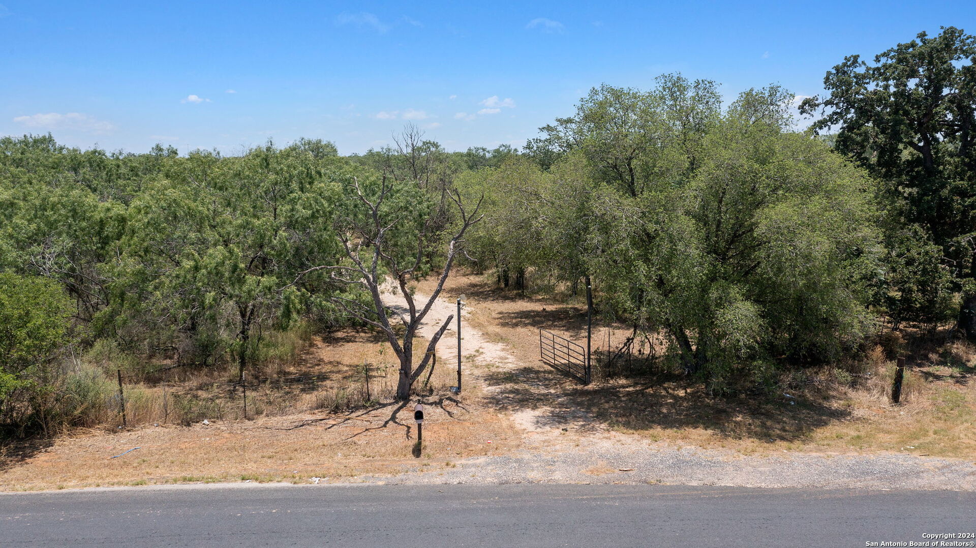 19366 Benton City Road Von Ormy, TX 78073 - Photo 10 of 24 a view of a wooden bridge