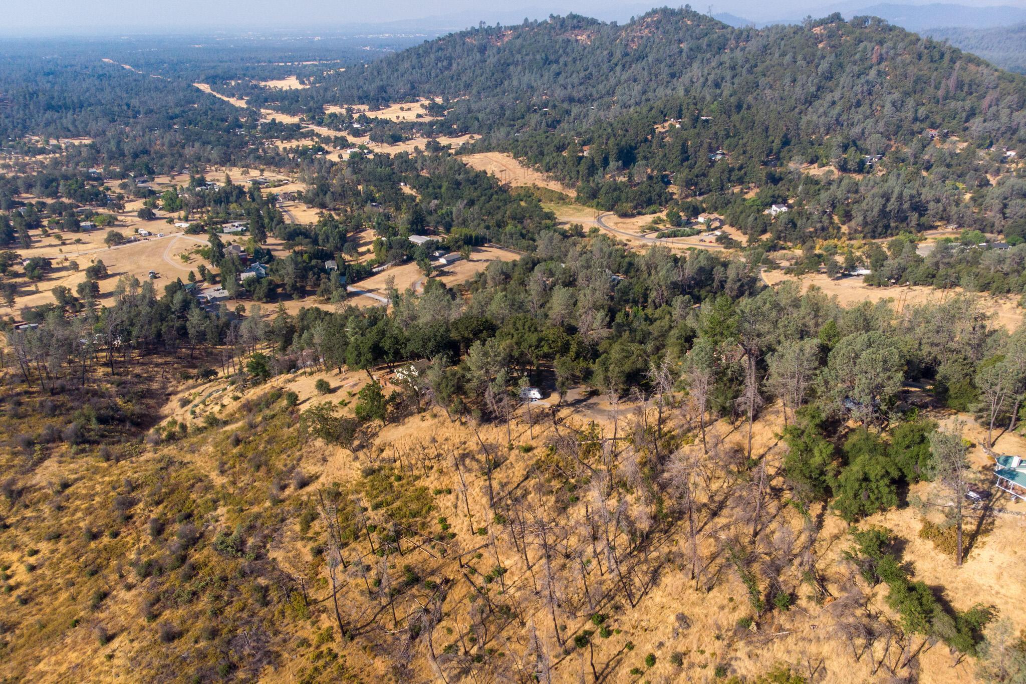 0 Wintu Way Redding, CA 96003 - Photo 9 of 11 an aerial view of house with yard and mountain view in back