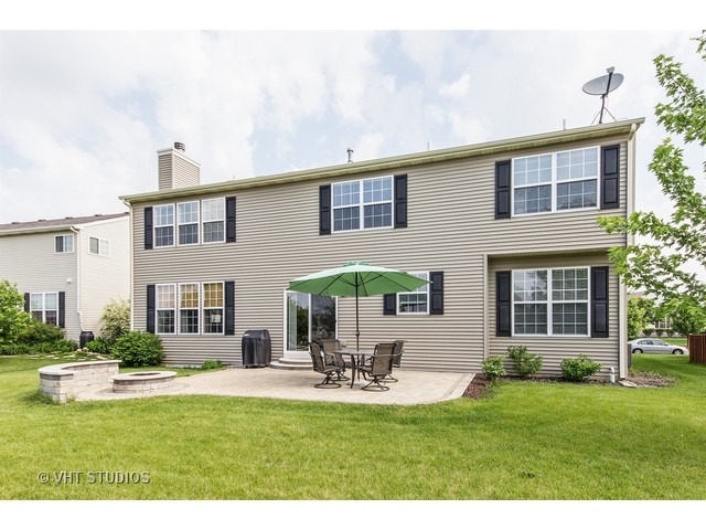 3153 Riley Road Montgomery, IL 60538 - Photo 15 of 15 a house view with swimming pool and chairs