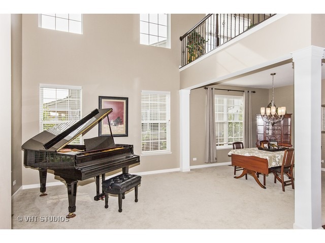 3153 Riley Road Montgomery, IL 60538 - Photo 2 of 15 a living room with furniture and a piano