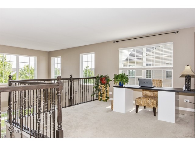 3153 Riley Road Montgomery, IL 60538 - Photo 7 of 15 a living room with a large window and furniture