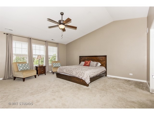 3153 Riley Road Montgomery, IL 60538 - Photo 8 of 15 a bedroom with a bed and large window