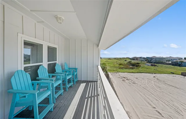 a view of balcony with furniture