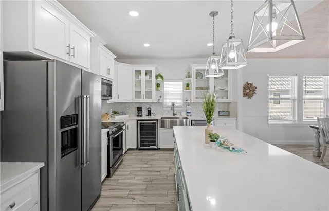 a large kitchen with stainless steel appliances lots of counter space and refrigerator