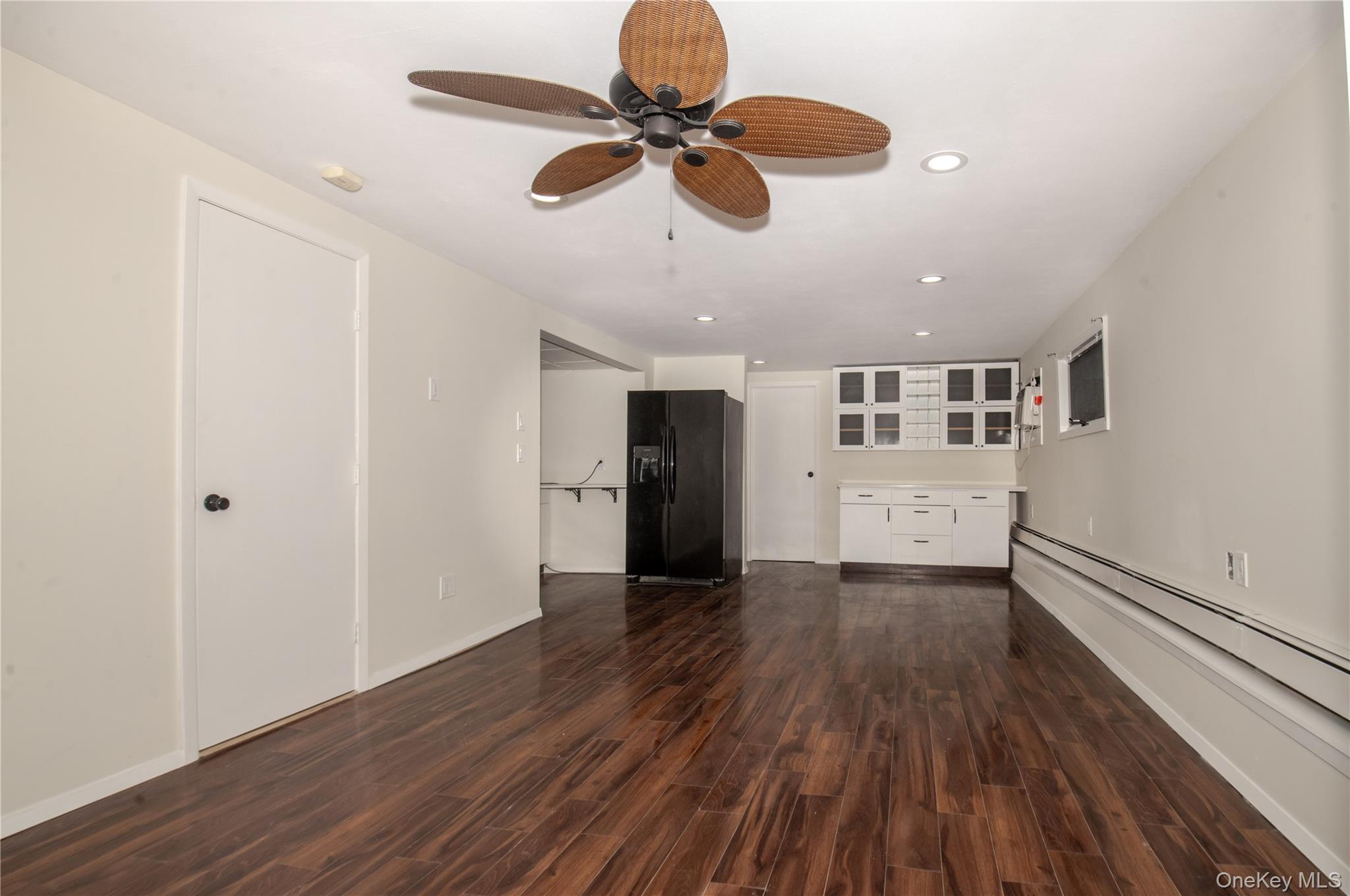 15 East Clearwater Road Lindenhurst, NY 11757 - Photo 21 of 25 a view of an empty room with wooden floor