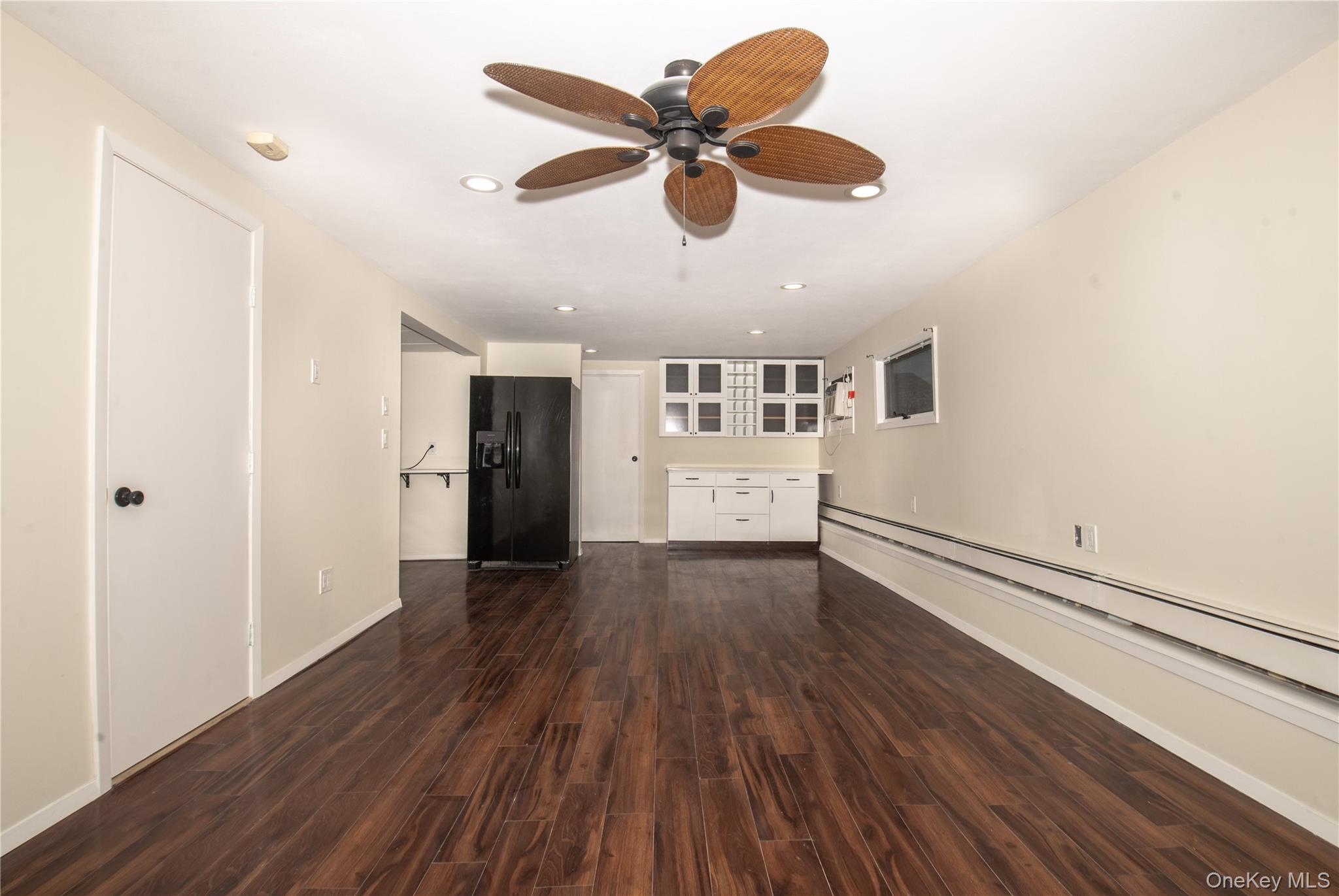 15 East Clearwater Road Lindenhurst, NY 11757 - Photo 23 of 25 a view of an empty room with wooden floor