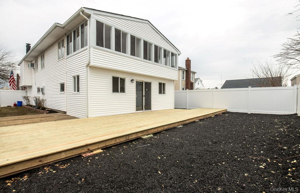 15 East Clearwater Road Lindenhurst, NY 11757 - Photo 24 of 25 a view of a house with a roof