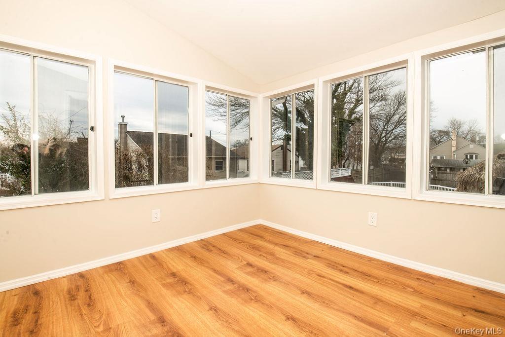 15 East Clearwater Road Lindenhurst, NY 11757 - Photo 10 of 25 a view of a large window with an outdoor space