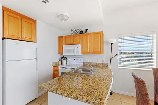 a view of a balcony with chair and table