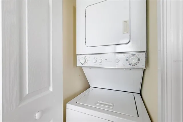 a view of a swimming pool with a table and chairs