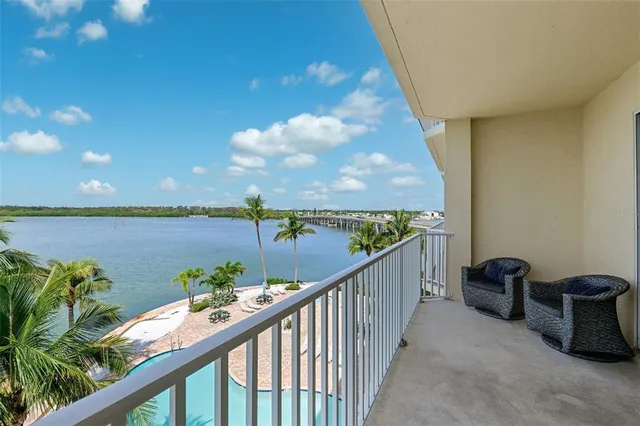 a view of a swimming pool with a lounge chairs