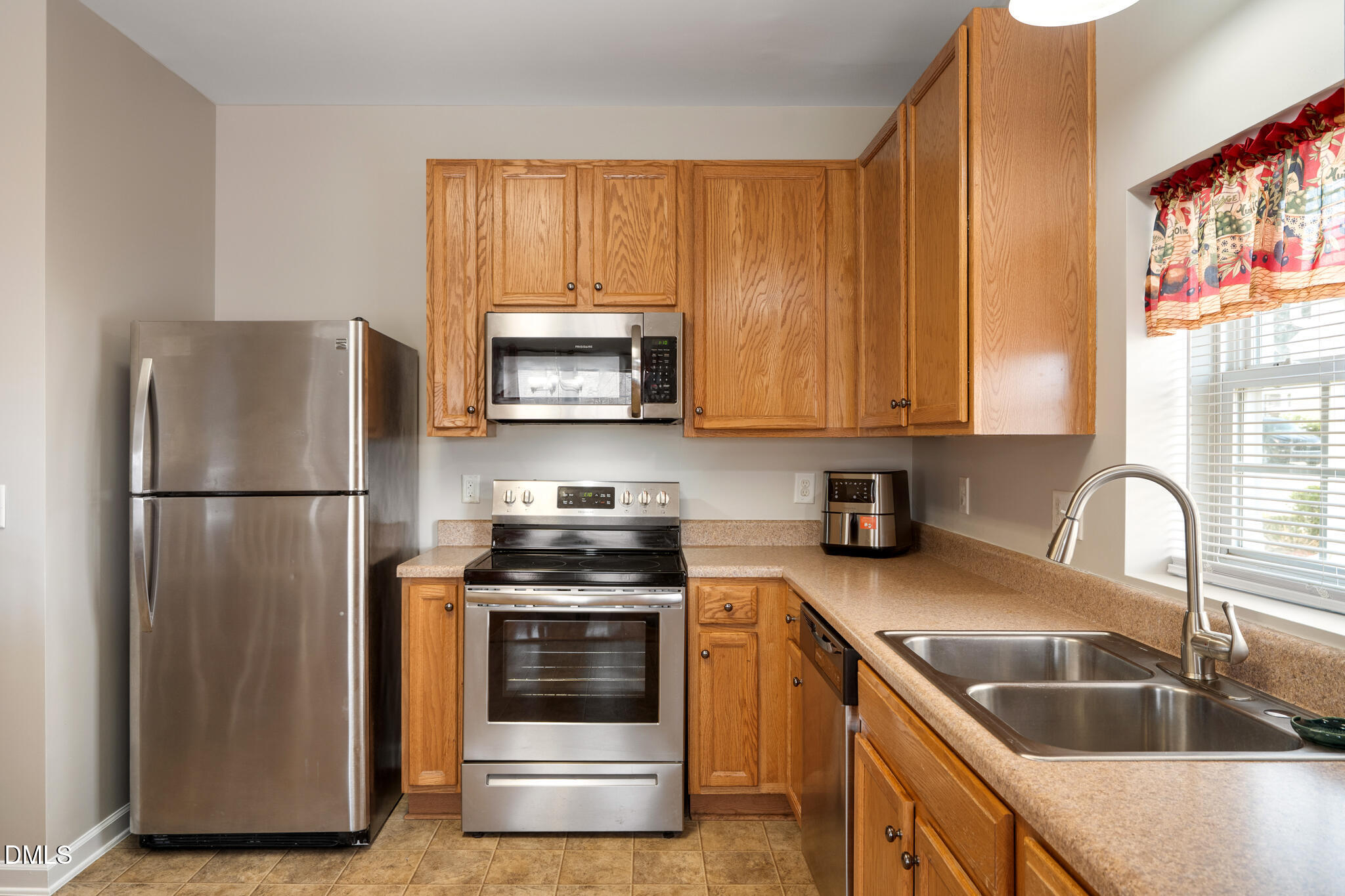 2019 Tennessee Road Durham, NC 27704 - Photo 13 of 28 a kitchen with a refrigerator sink and microwave