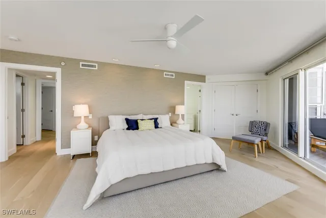 a bedroom with a bed and a lamp