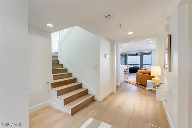 a view of a living room and entryway