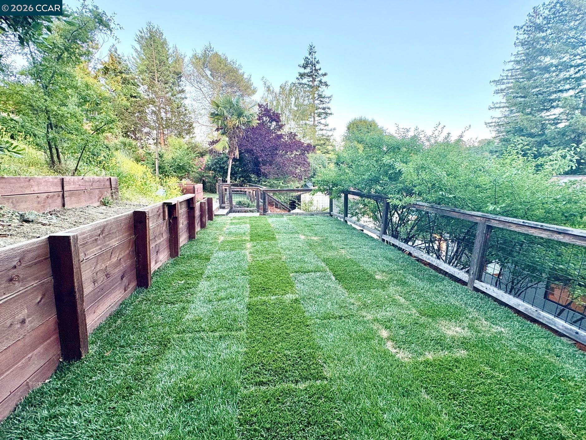 2589 Pebble Beach Loop Lafayette, CA 94549 - Photo 28 of 32 a view of a house with a backyard and a patio