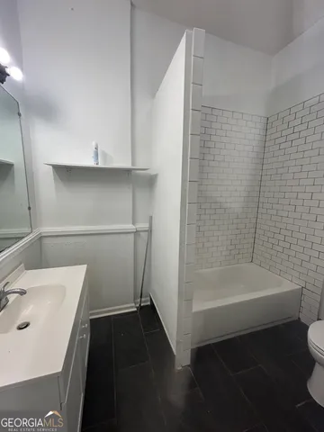 a bathroom with a sink and a shower