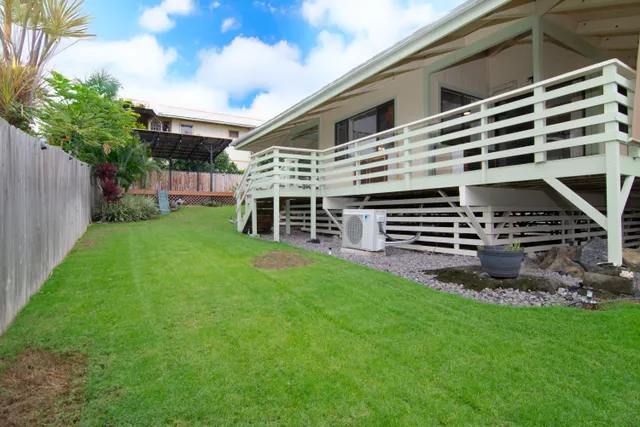 a backyard of a house with lots of green space