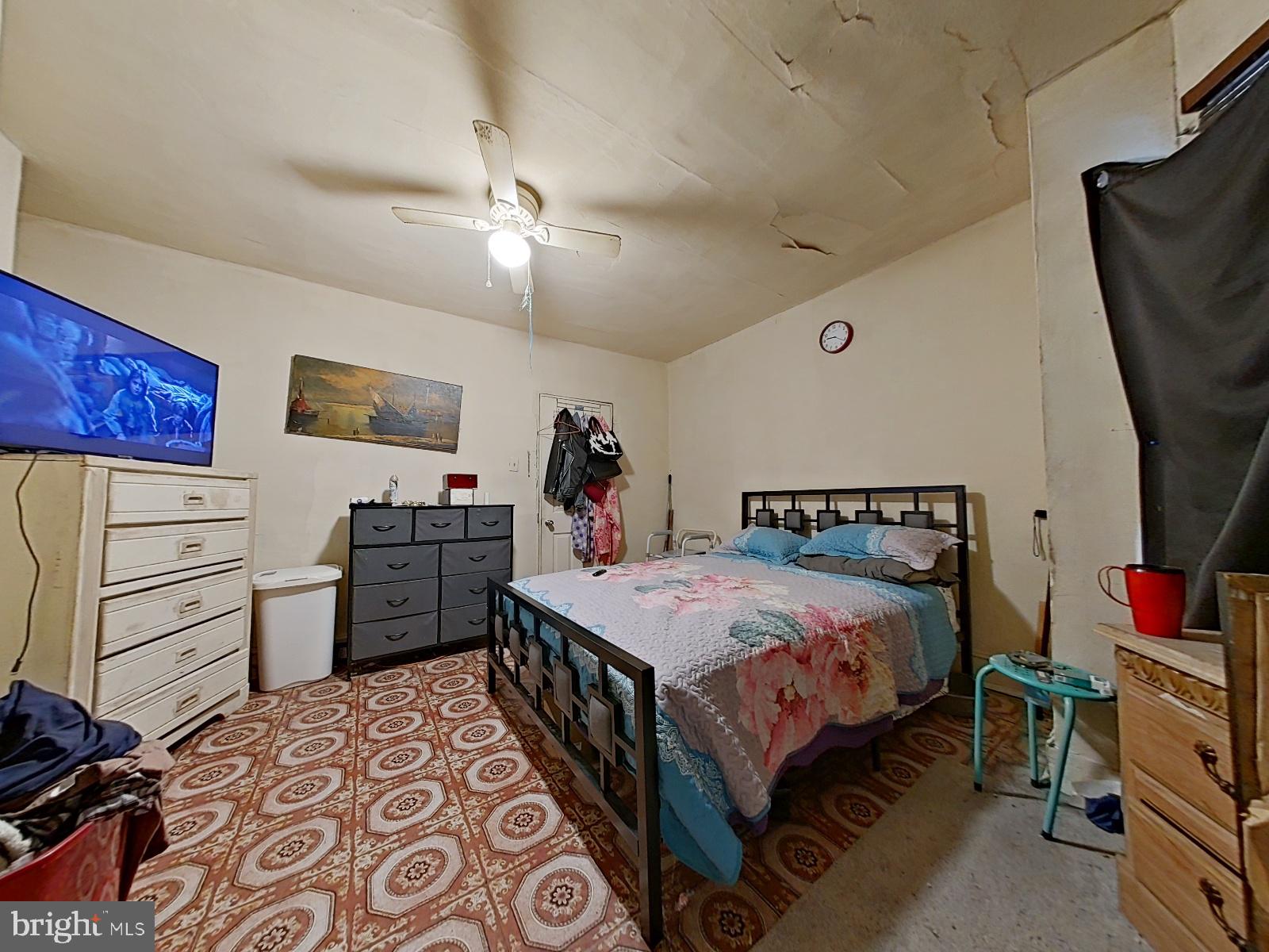 5152 Funston Street Philadelphia, PA 19139 - Photo 13 of 22 a bed room with a bed and a television